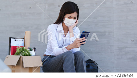 Asian woman being fired 77286434