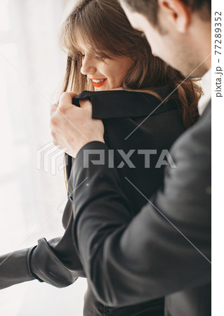 Portrait of young couple in love posing at studio 77289352