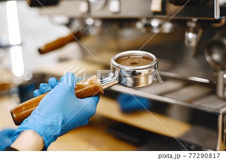 Ground coffee in a holder for making coffee 77290817