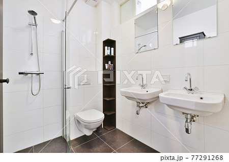 Interior of white modern bathroom in apartment Interior of white modern bathroom in apartment 77291268