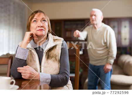 Offended elderly woman during quarrel with husband 77292596