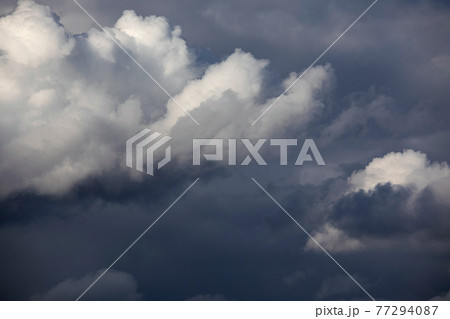 Dark cloudy sky. Overcast sky before rain. Large blue storm clouds 77294087