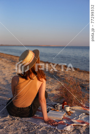 girl resting on the beach 77299332