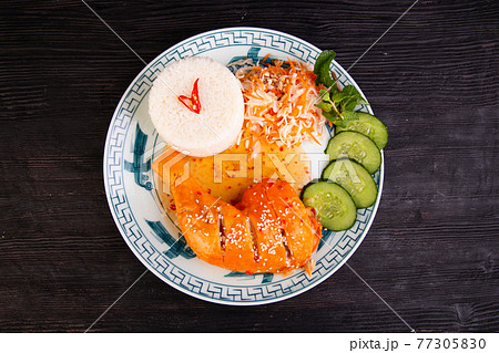 ham chicken, fried in tomato sauce, sprinkled with sesame, served with cabbage and boiled rice ham chicken, fried in tomato sauce, sprinkled with sesame, served with cabbage and boiled rice 77305830