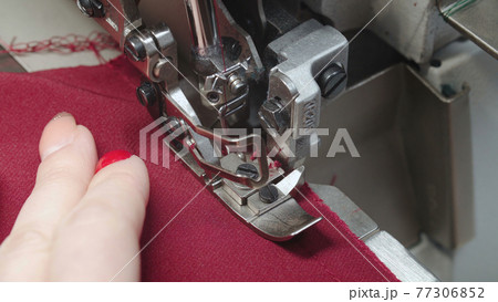 Shooting of tailor sewing order on electric overlock 77306852