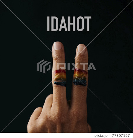V sign, rainbow flag and text IDAHOT V sign, rainbow flag and text IDAHOT 77307197