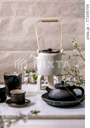 White and black handmade ceramic teapot for tea ceremony White and black handmade ceramic teapot for tea ceremony 77309709