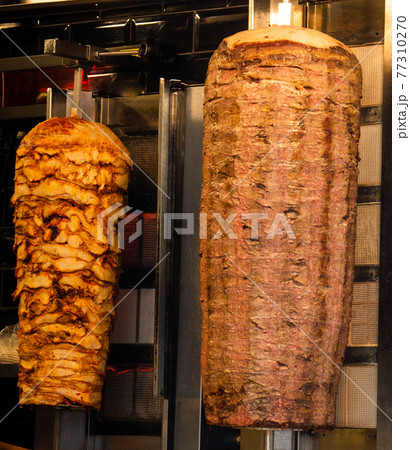 Traditional Turkish Doner Kebab kebab on skewer. Turkish cuisine street food Traditional Turkish Doner Kebab kebab on skewer. Turkish cuisine street food 77310270
