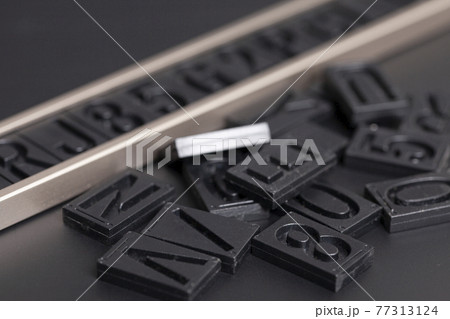 letterpress alphabet and numbers on black background letterpress alphabet and numbers on black background 77313124