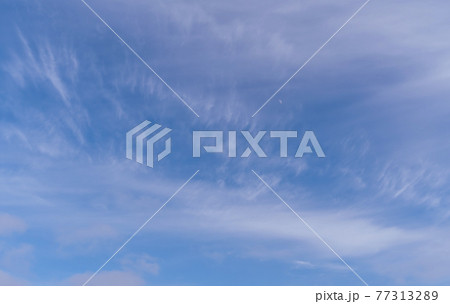 Abstract template with blue sky, white clouds and waxing half moon. Abstract natural background. Abstract template with blue sky, white clouds and waxing half moon. Abstract natural background. 77313289