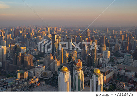 Aerial view of Bangkok Downtown Skyline, Thailand. Financial district and business centers in smart urban city in Asia. Skyscraper and high-rise buildings at sunset. 77313478