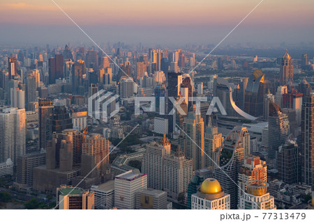 Aerial view of Bangkok Downtown Skyline, Thailand. Financial district and business centers in smart urban city in Asia. Skyscraper and high-rise buildings at sunset. Aerial view of Bangkok Downtown Skyline, Thailand. Financial district and business centers in smart urban city in Asia. Skyscraper and high-rise buildings at sunset. 77313479