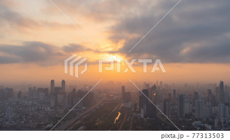 Aerial view of Bangkok Downtown Skyline, Thailand. Financial district and business centers in smart urban city in Asia. Skyscraper and high-rise buildings at sunset. 77313503