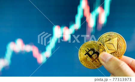 Hand holding gold Bitcoin and Ethereum Hand holding gold Bitcoin and Ethereum 77313973