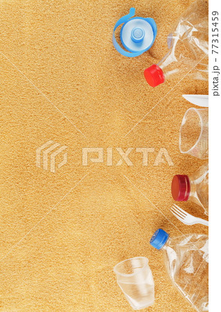 Plastic trash on a sandy beach with Trash from plastic bottles on a sandy beach with free space. Plastic trash on a sandy beach with Trash from plastic bottles on a sandy beach with free space. 77315459