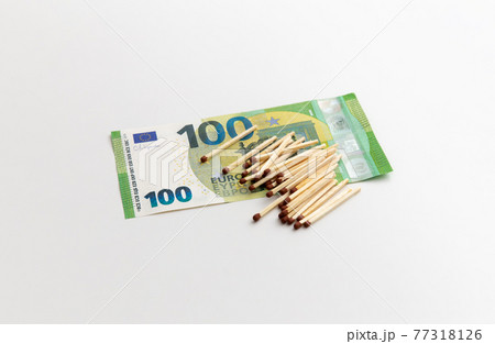 Matches are on 100 euro banknotes, made of wood, production of matchsticks, white background Matches are on 100 euro banknotes, made of wood, production of matchsticks, white background 77318126