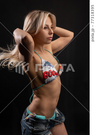 Girl blonde in a swimsuit on a black background sportsspan fitness beautiful blonde black, beautiful swimwear posing swim, lady 20s. Latino white ethnic latin legs Girl blonde in a swimsuit on a black background sportsspan fitness beautiful blonde black, beautiful swimwear posing swim, lady 20s. Latino white ethnic latin legs 77318395