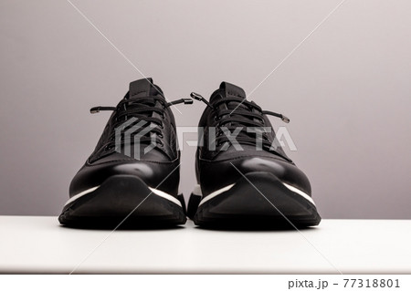 Pair of new unbranded black sport running shoes, sneakers or trainers isolated on white background Pair of new unbranded black sport running shoes, sneakers or trainers isolated on white background 77318801