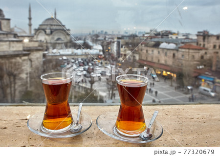 Two glasses of Turkish black tea against backdrop of Istanbul landscape. Two glasses of Turkish black tea against backdrop of Istanbul landscape. 77320679