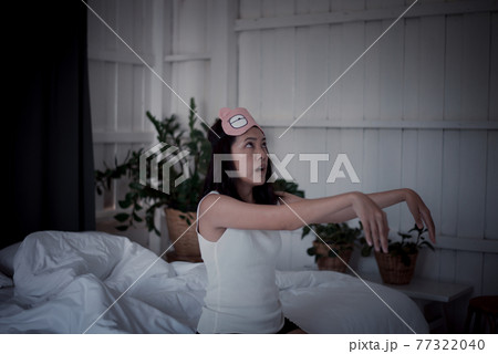 Woman sleepwalker with somnambulism sleep and walking in bedroom 77322040