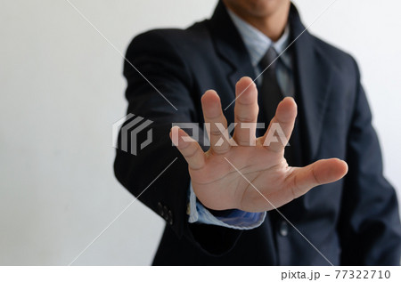 Business man wearing a suit raised five fingers. Business man wearing a suit raised five fingers. 77322710