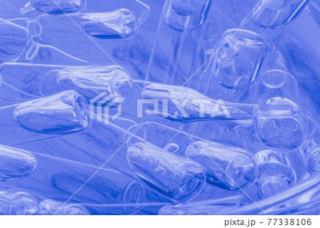 Glass medical ampoule vial for injection. Medicine is liquid sodium chloride with of aqueous solution in ampulla. Close up. Bottles ampule multicolor. Glass medical ampoule vial for injection. Medicine is liquid sodium chloride with of aqueous solution in ampulla. Close up. Bottles ampule multicolor. 77338106