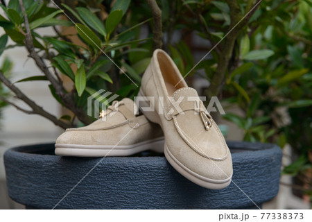 Woman's coral stylish suede loafer shoes. Pair of trendy female loafers shoes Woman's coral stylish suede loafer shoes. Pair of trendy female loafers shoes 77338373
