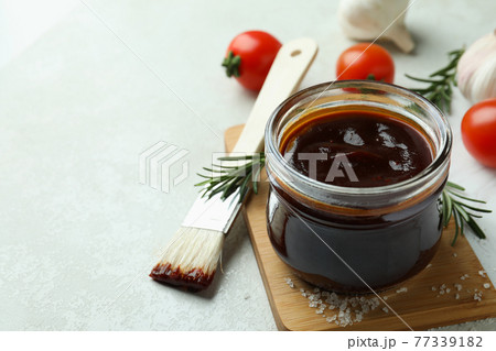 Concept of cooking with barbecue sauce on white textured table 77339182
