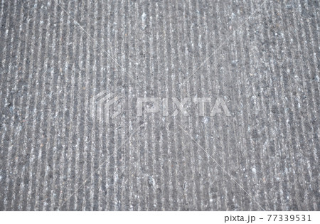 asphalt road in need of repair 77339531