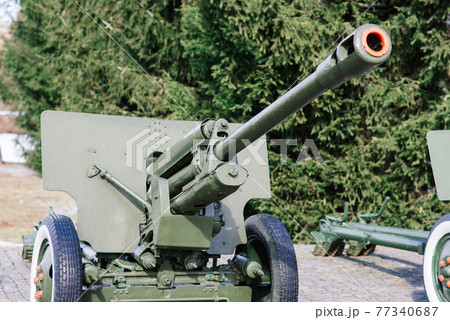 View of the russian cannons and howitzers in a park. Military museum outdoors View of the russian cannons and howitzers in a park. Military museum outdoors 77340687