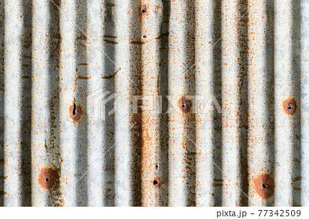 Grunge silver and red rust corrugated iron metal plate textured background Grunge silver and red rust corrugated iron metal plate textured background 77342509