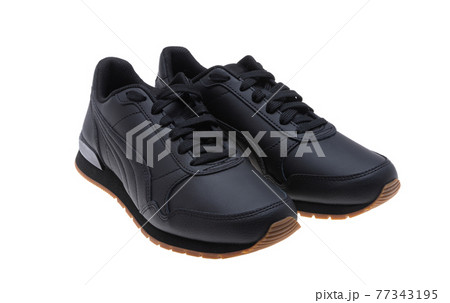 black leather sneakers isolated black leather sneakers isolated 77343195