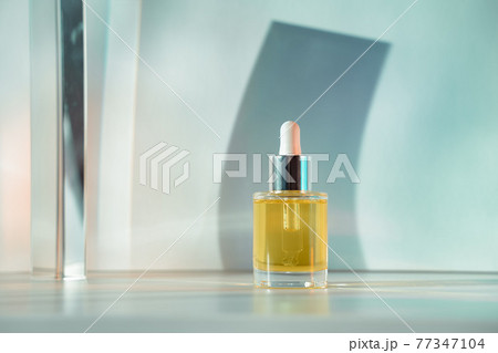 Yellow face oil on light green blue background 77347104