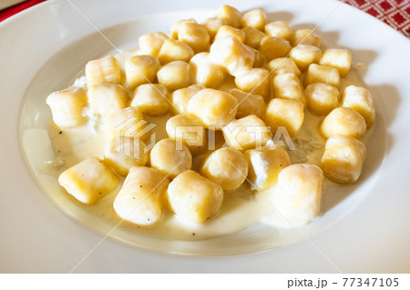 Italian cuisine - gnocchi with Gorgonzola 77347105