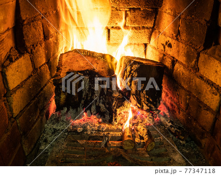 above view of burning firewood in hearth above view of burning firewood in hearth 77347118