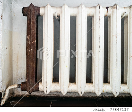 shabby heating radiator with fixed rusty section shabby heating radiator with fixed rusty section 77347137