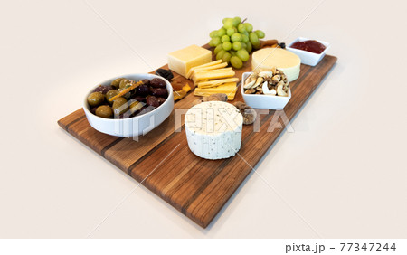 Delicious Cheese Assortment on a wooden board 77347244
