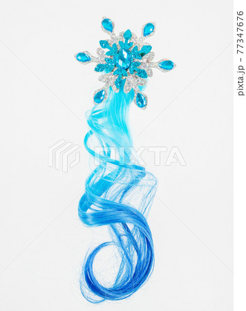Children's decoration on a white background. A snowflake and a lock of hair. Children's decoration on a white background. A snowflake and a lock of hair. 77347676