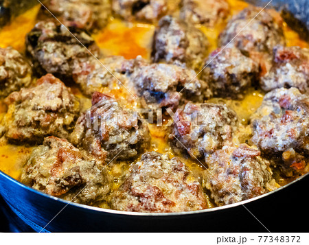 meatballs are stewed in saucepan close up meatballs are stewed in saucepan close up 77348372