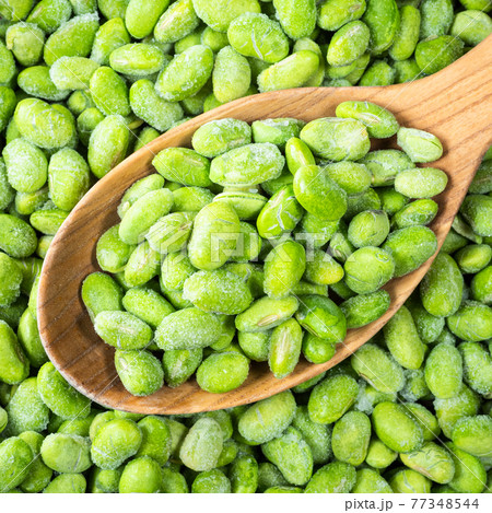 frozen Edamame soybeans in wooden spoon closeup 77348544
