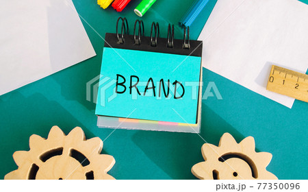 Notes with inscription Brand. Business, marketing, and advertising. Name, term, design, symbol that identifies one seller's good or service. Gears, markers, ruler. Notes with inscription Brand. Business, marketing, and advertising. Name, term, design, symbol that identifies one seller's good or service. Gears, markers, ruler. 77350096