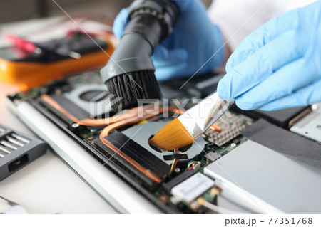 Computer hard drive repair and maintenance closeup Computer hard drive repair and maintenance closeup 77351768