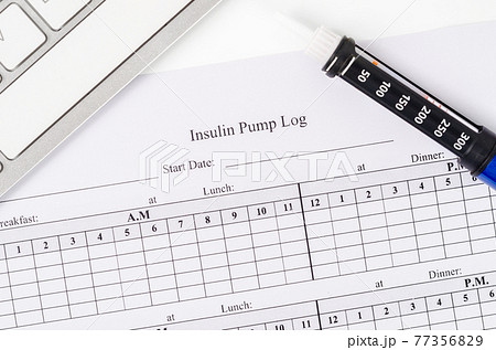 Insulin pump log record form and syringe wiht insulin. Insulin pump log record form and syringe wiht insulin. 77356829