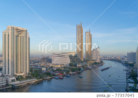 Aerial view of Icon Siam with Chao Phraya River, Bangkok Downtown. Thailand. Financial district and business centers in smart urban city. Skyscraper and high-rise buildings. Aerial view of Icon Siam with Chao Phraya River, Bangkok Downtown. Thailand. Financial district and business centers in smart urban city. Skyscraper and high-rise buildings. 77357045