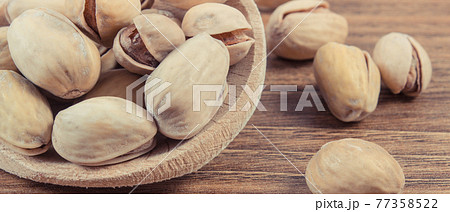 Pistachio nuts as source vitamins and minerals. Healthy eating 77358522