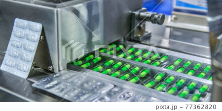 Green capsule medicine pill production line, Industrial pharmaceutical concept Green capsule medicine pill production line, Industrial pharmaceutical concept 77362820