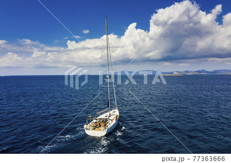Yacht sailing at sunset during a storm. Luxury vacation at sea Yacht sailing at sunset during a storm. Luxury vacation at sea 77363666