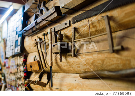 Ancient interior of a rural house in an ethnographic park. Old stove 77369098