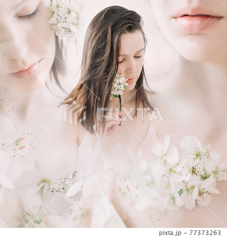 Young beautiful woman with flowers on white background. Tender pure portrait. Face skincare and health wellness, Natural makeup. Young beautiful woman with flowers on white background. Tender pure portrait. Face skincare and health wellness, Natural makeup. 77373263