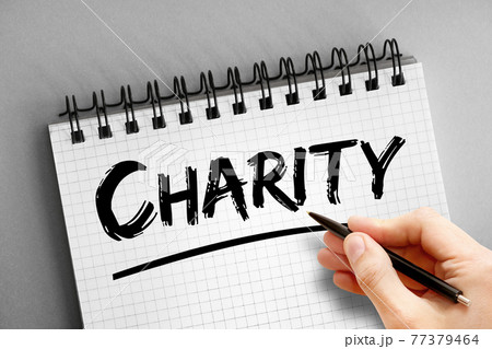 Charity text on notepad, concept background Charity text on notepad, concept background 77379464